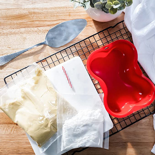 A collection of ingredients for red velvet cake: flour, cocoa, sugar, eggs, buttermilk, and red dye