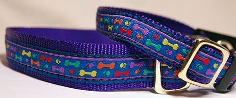 Adjustable purple dog collar adorned with multicolored bone designs